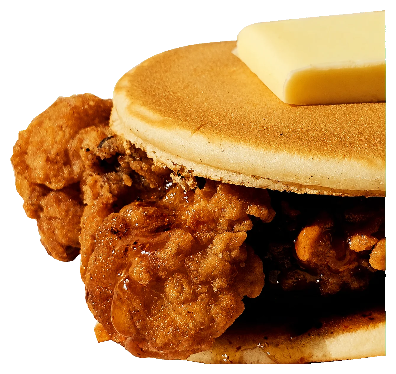 Fried chicken pancake sando topped with butter and syrup
